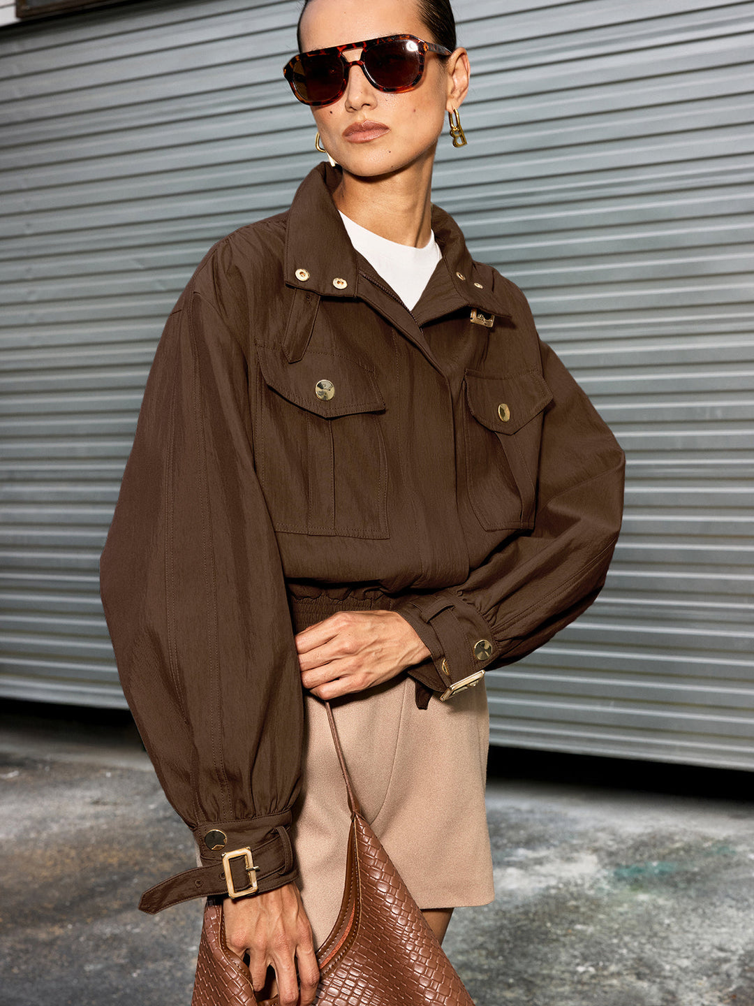 Dark brown colourway of the belted collar cotton blend cropped jacket, front view