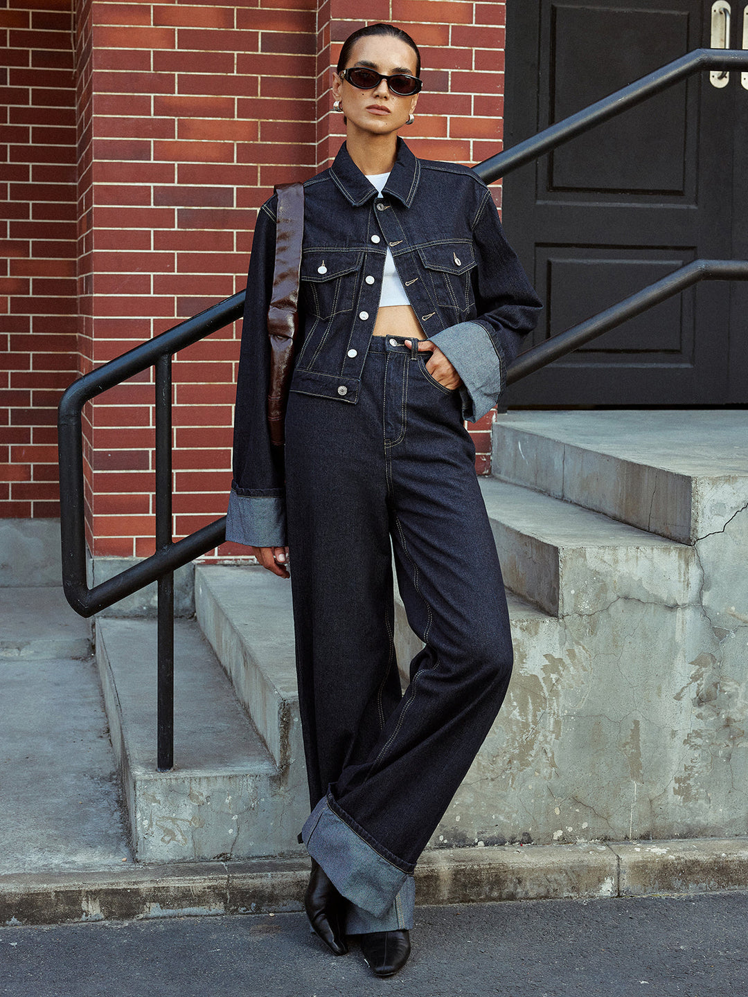 Full-length denim on denim look: cuffed jacket with wide leg turn-up jeans