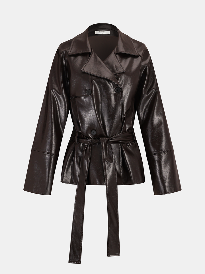 Three-quarter angle of the short brown faux leather trench with knotted belt