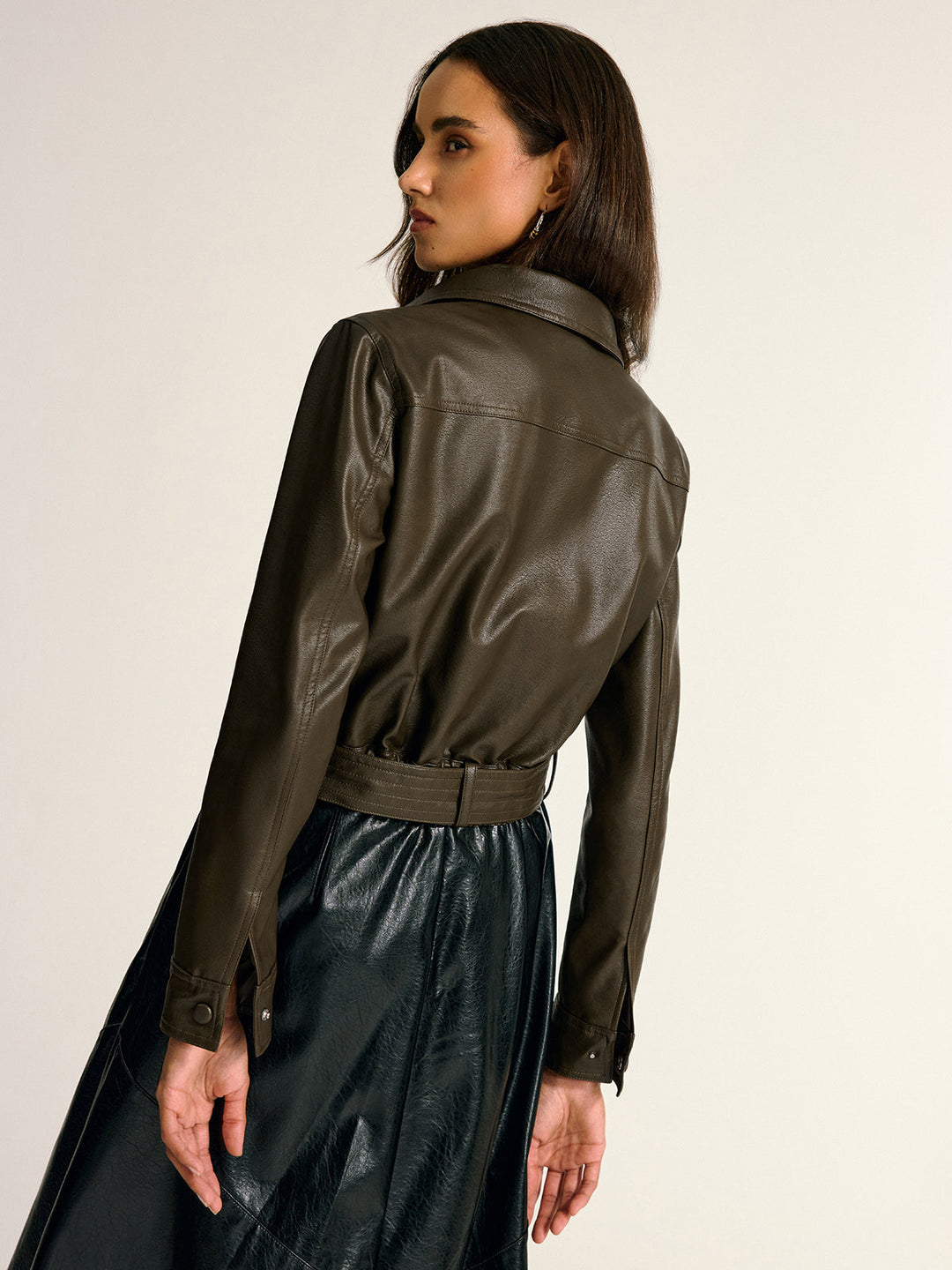 Back view of the khaki PU leather shirt jacket with belted waist