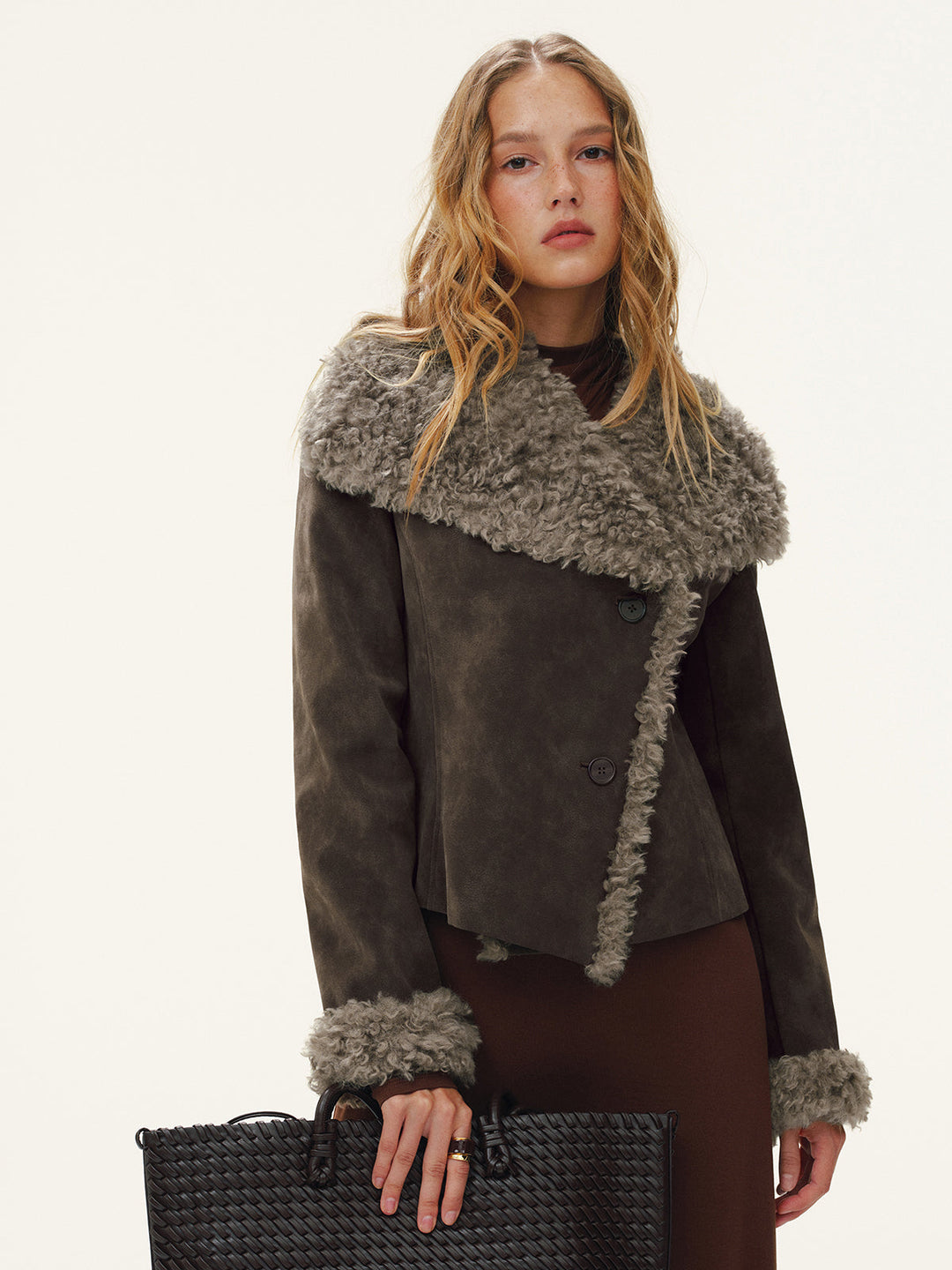 Women's cropped faux shearling trim jacket, front view with wide fur lapel and fur cuffs