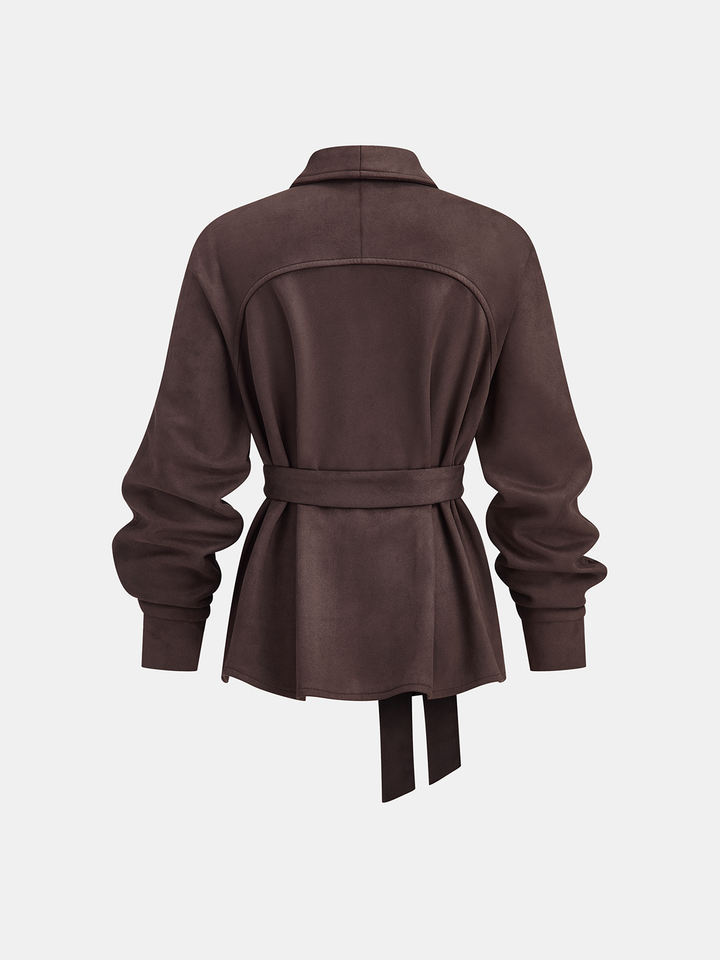 Back view of the chocolate belted jacket with curved yoke and knotted waist tie