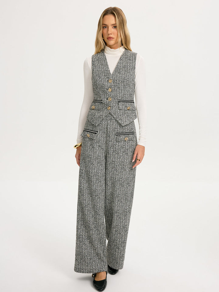 Full-length grey herringbone tweed vest and wide-leg trouser suit with black heels