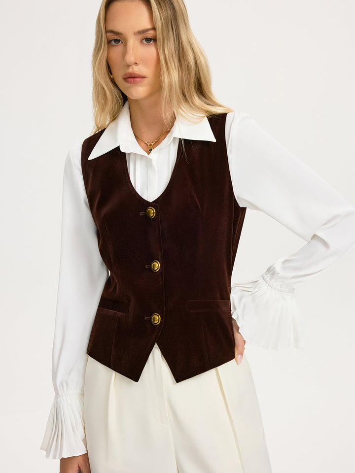 Front view of the fitted brown velvet vest showing the curved hem and slim waist seams