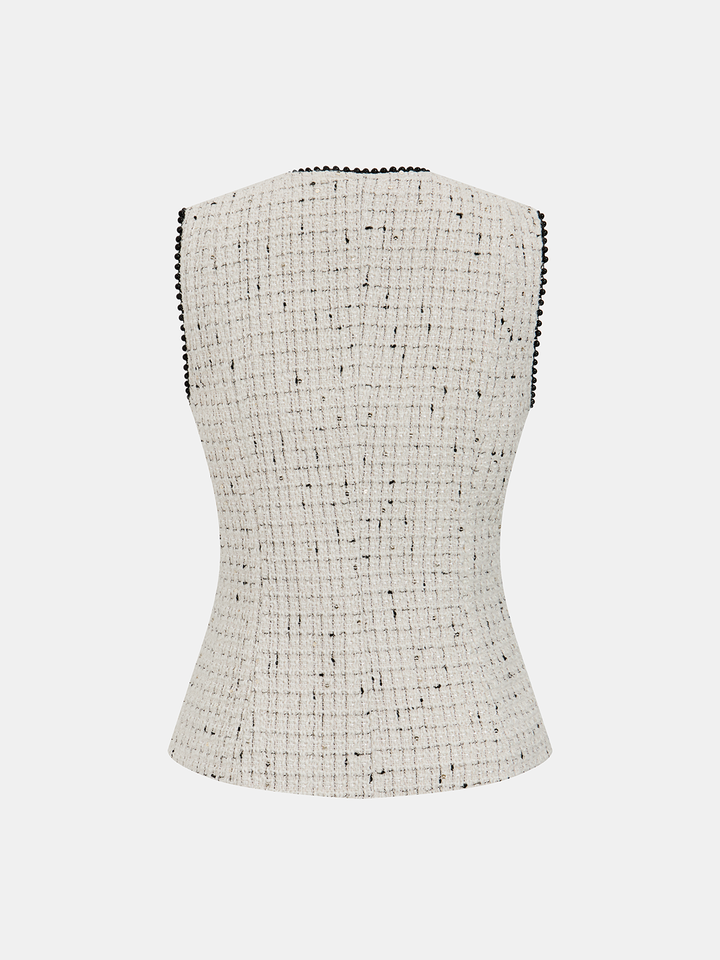 Back view of cream tweed vest with contrast black beaded edging at neckline