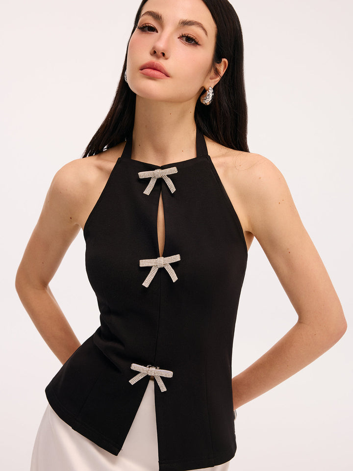 Black halter vest top with crystal bow details along the keyhole front opening