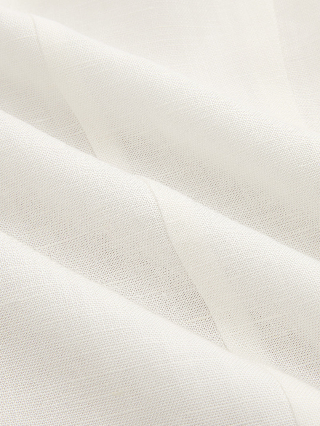 Macro of the natural ivory linen blend fabric used for this lace panel blazer vest
