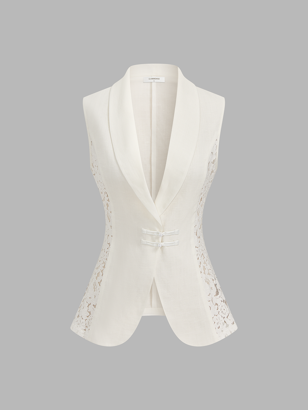 Front view of the ivory frog button waistcoat showing lace inserts and open lapel