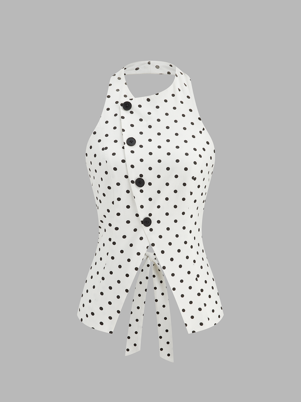 Polka dot button front halter top front view with split peplum hem
