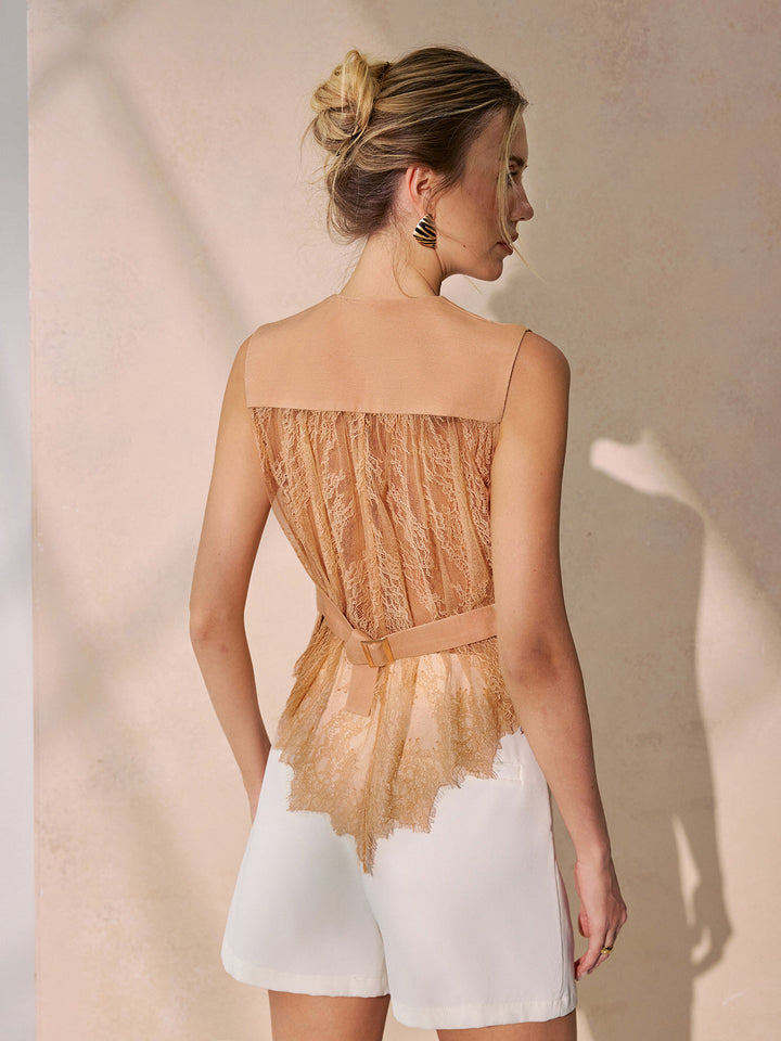 Back view of khaki linen blend vest with sheer lace back panel and tie belt, worn with white shorts