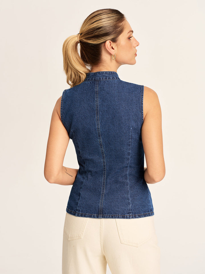 Back view of the blue denim stand collar vest with centre seam and fitted waist