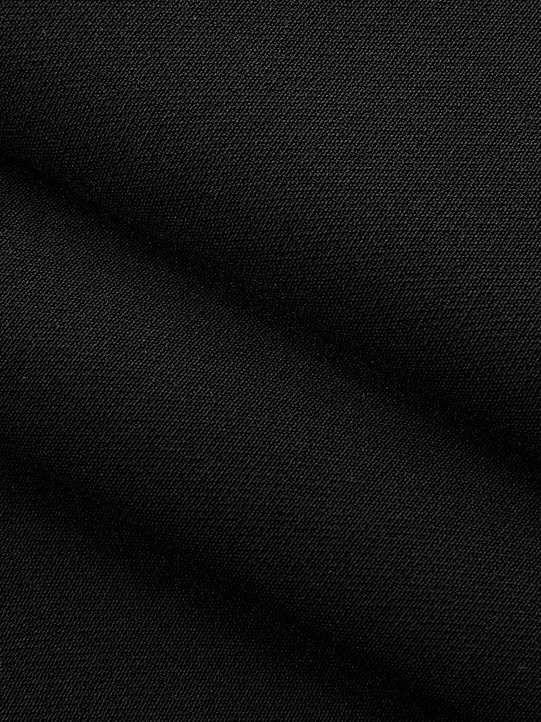 Macro of black woven twill fabric of the metal detail mandarin collar vest