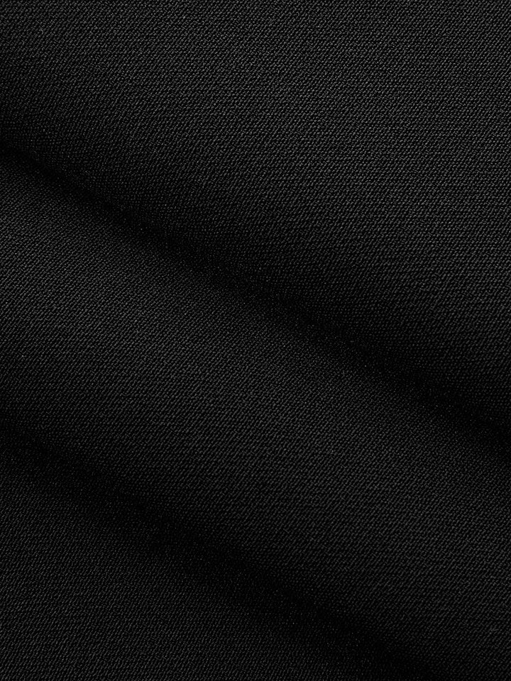 Macro of black woven twill fabric of the metal detail mandarin collar vest