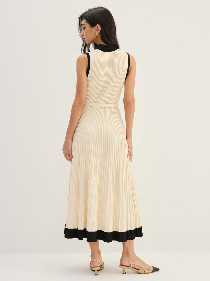 Back view of ivory pleated knit maxi dress with black contrast hem band