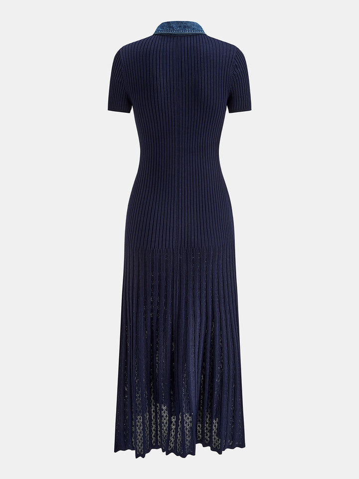Flat back view of the navy knit maxi dress with short sleeves and flared panelled skirt