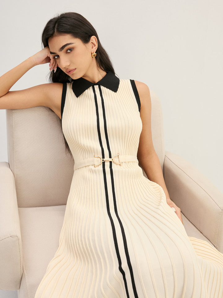 Detail of black Peter Pan collar on cream sleeveless ribbed knit dress