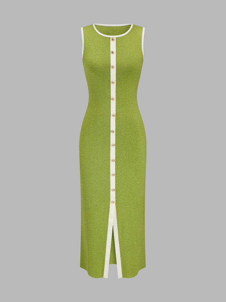 Front view of green ribbed knit maxi dress with ivory placket, gold buttons and front slit