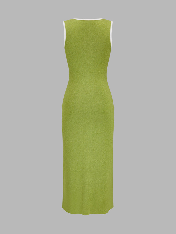 Back view of the sleeveless green knit maxi dress with white bound neckline