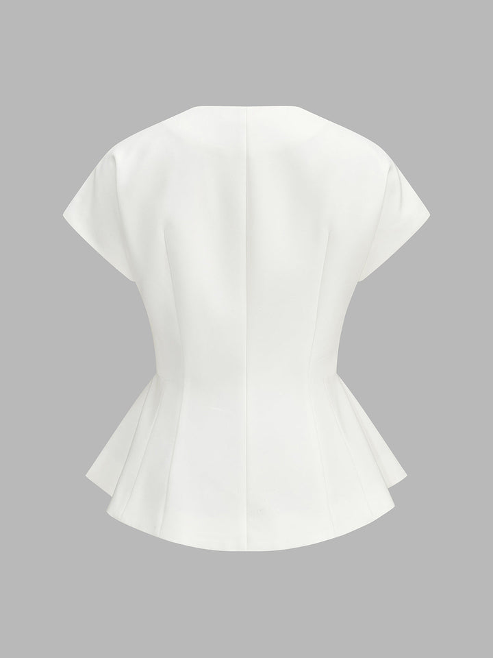 Back view of ivory cap sleeve top showing flared peplum hem and shaped waist seams