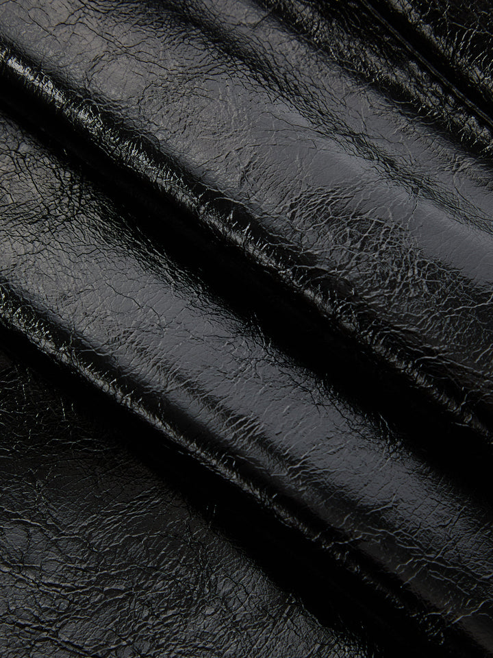Close-up of the crackle texture on the black faux leather sleeve