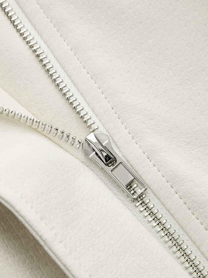 Close-up of the silver zip against the off-white faux leather