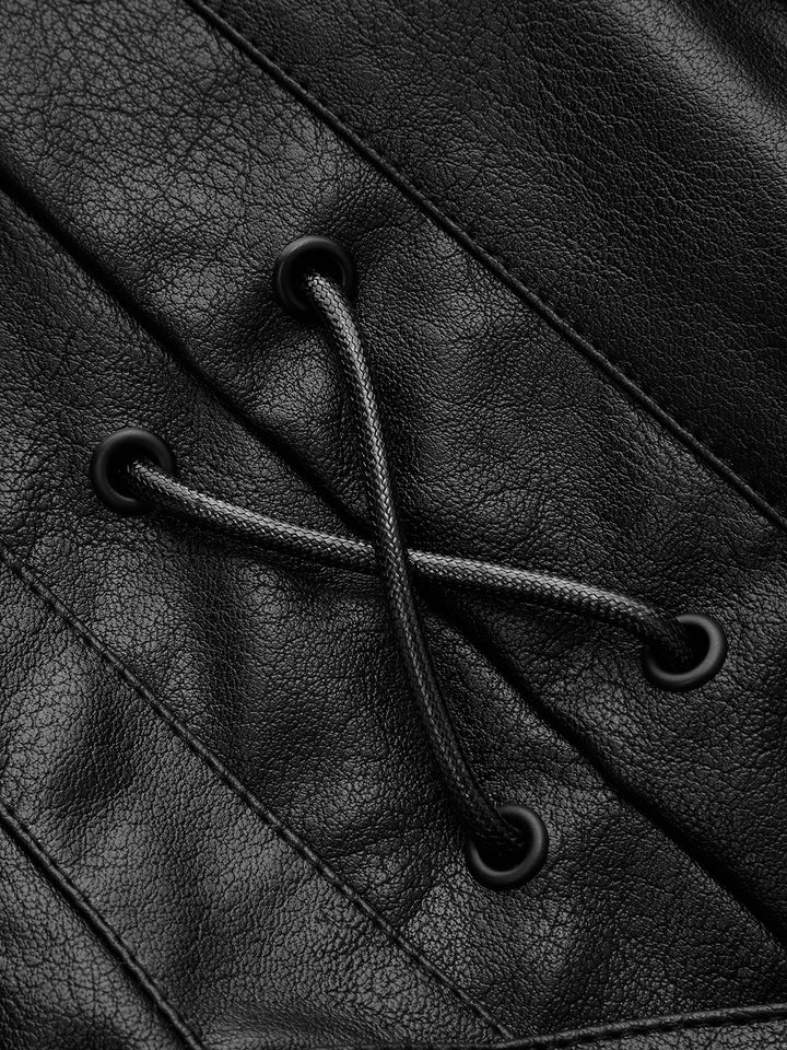 Close-up of the cord lacing and matte eyelets on the shoulder of the black jacket