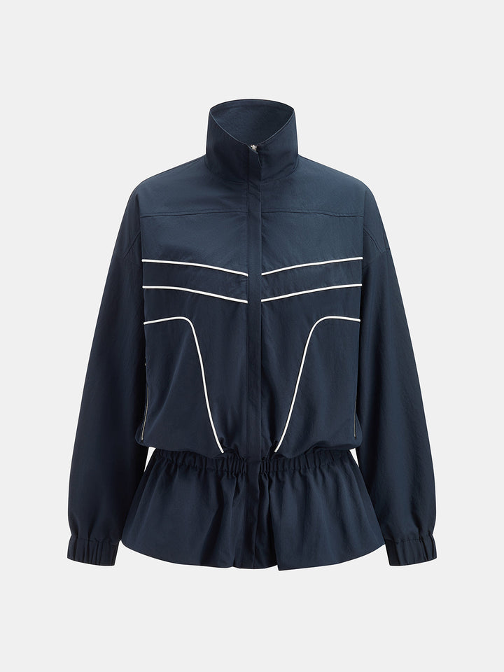 Front view of the navy cinched waist jacket with stand collar and white piped seams