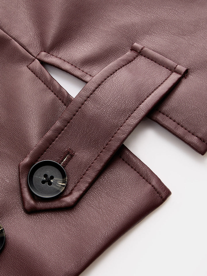 Close-up of the buttoned cuff tab on the burgundy leather look jacket