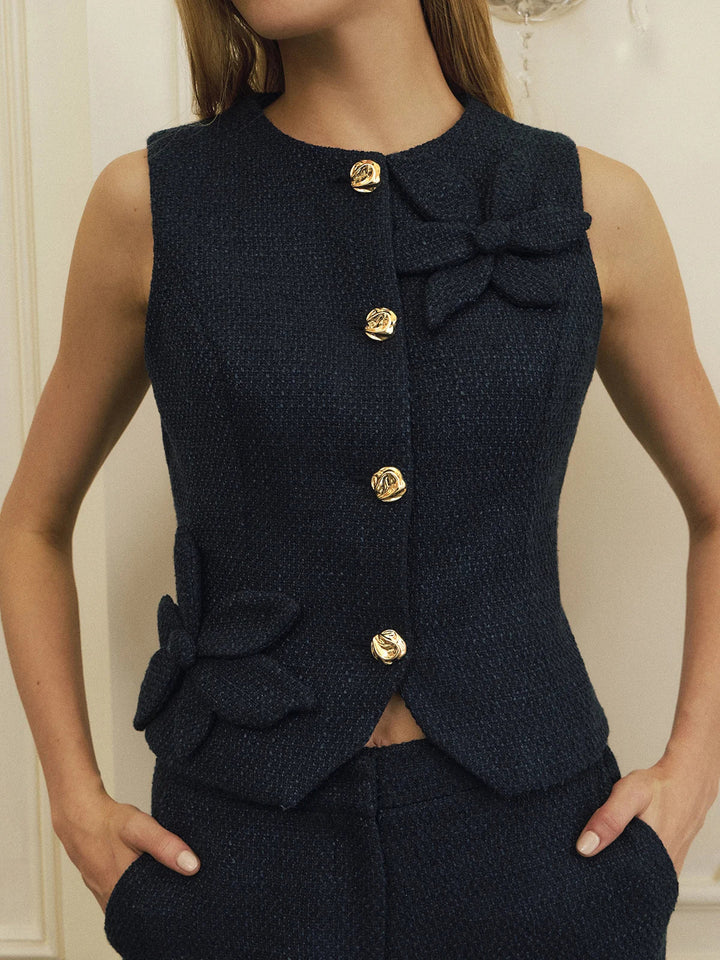 Navy tweed vest with 3D floral applique and gold buttons, close front view