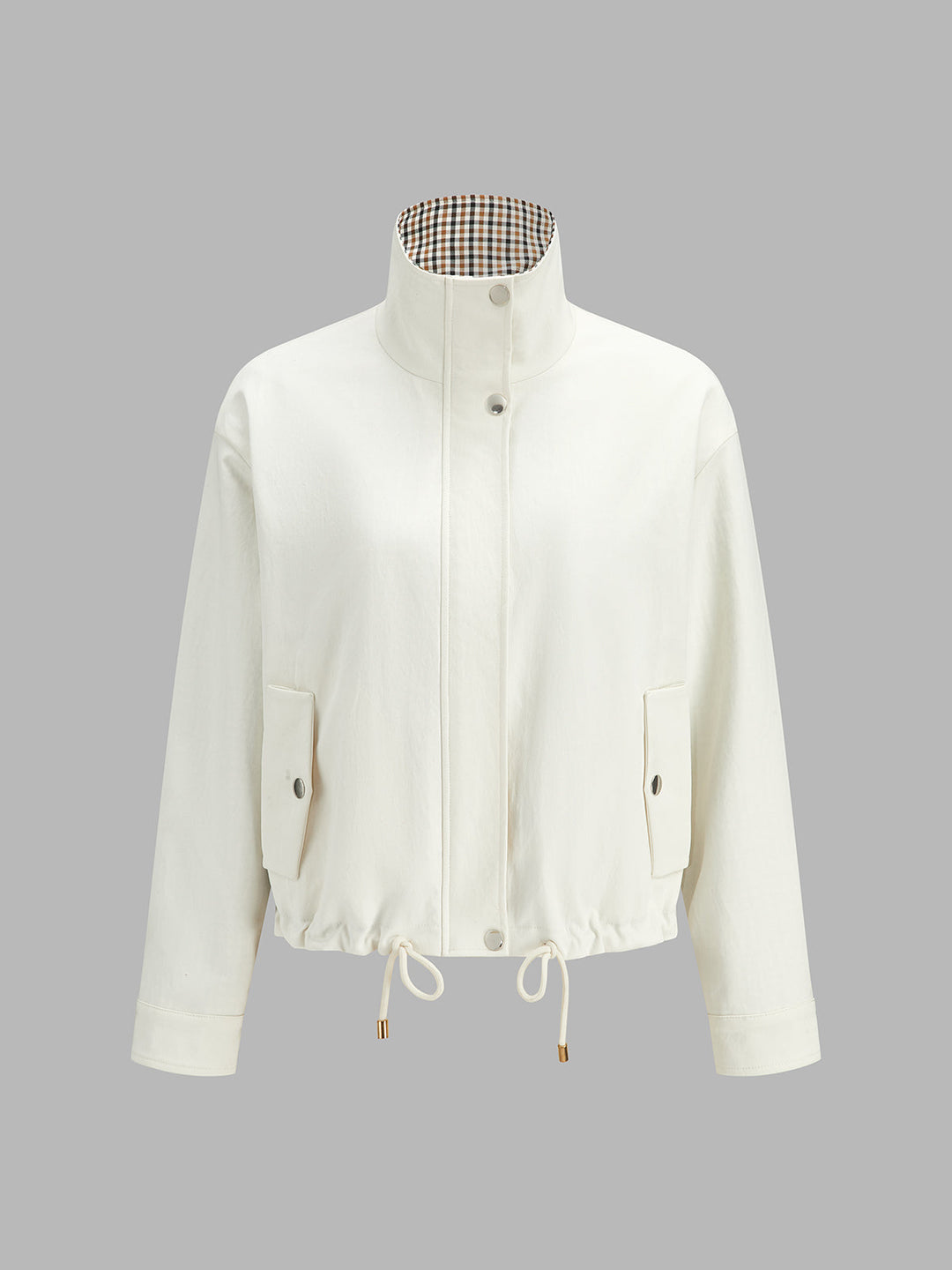 Product shot of off-white reversible jacket showing check-lined stand collar and zip front
