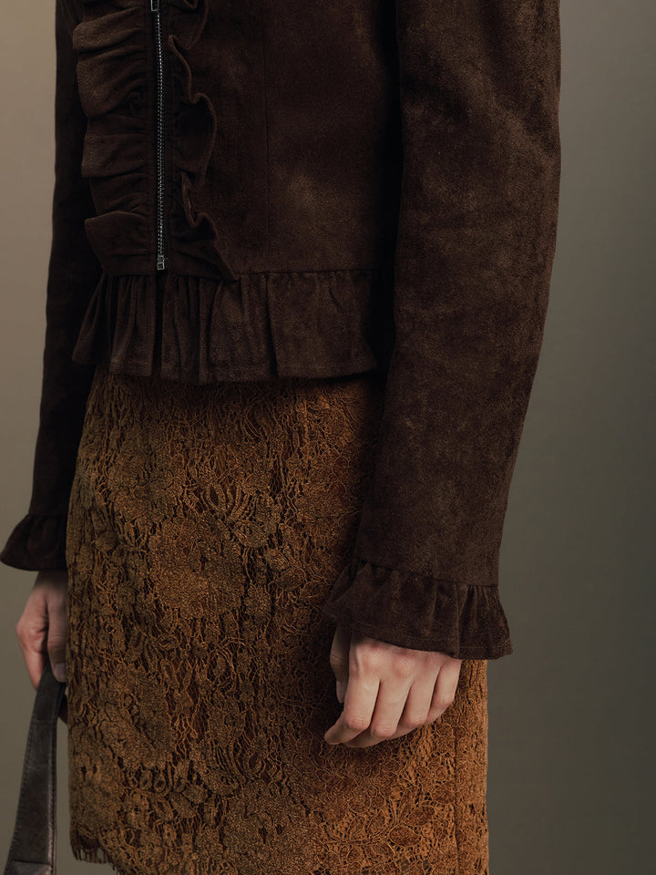 Detail of the ruffled peplum hem and frilled cuff on the dark brown faux suede jacket