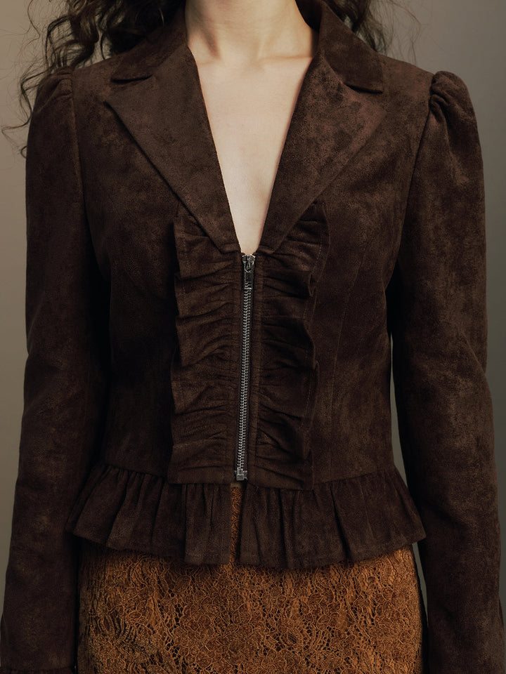 Close front view showing the ruched zip placket and notch collar of the suede jacket