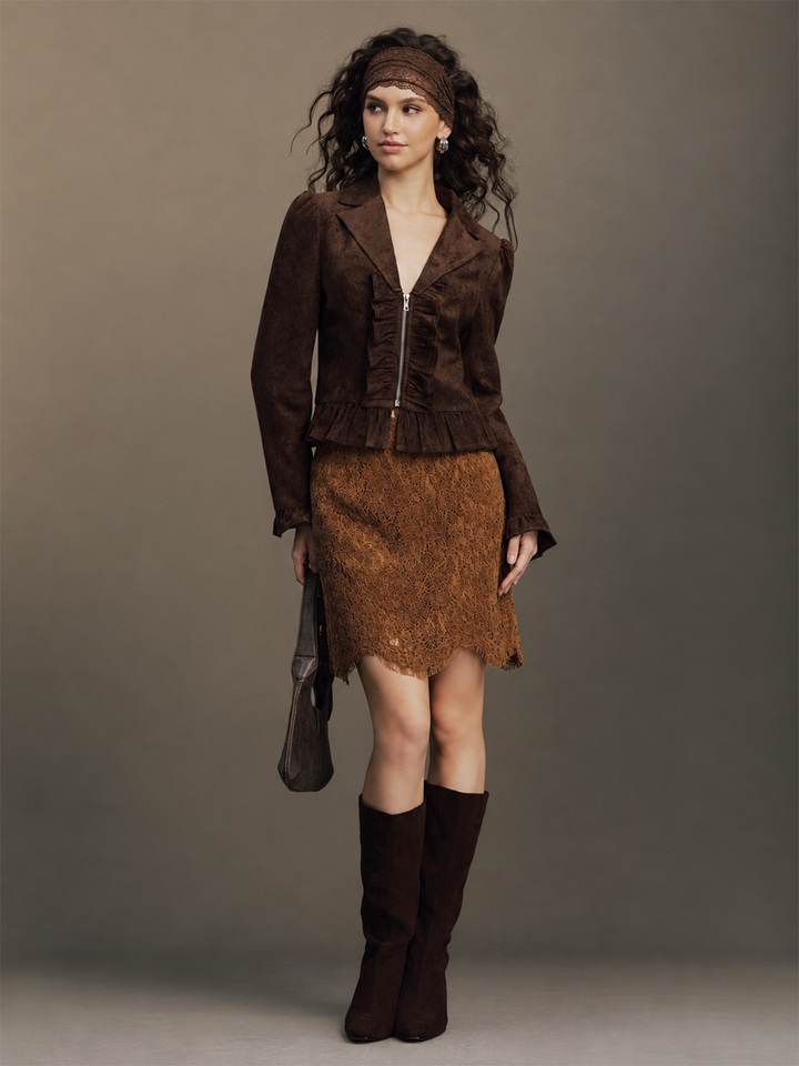 Full-length retro styling of the cropped brown suede ruffle jacket with shoulder bag