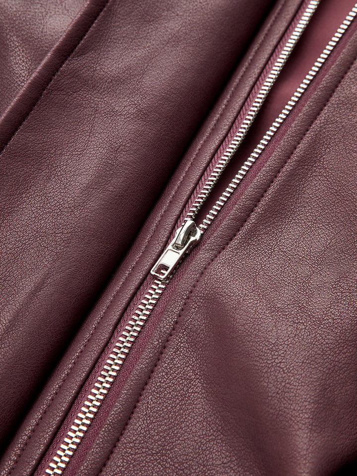 Close-up of the silver front zip on the deep wine leather look fabric