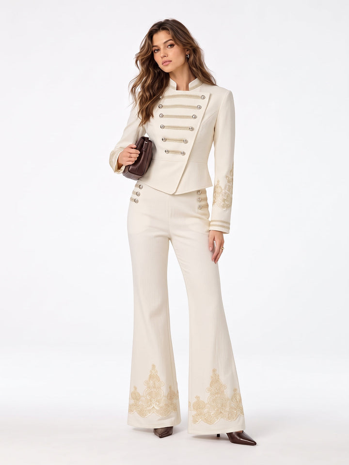 Cream lace sleeve napoleon jacket styled with matching embroidered wide leg trousers