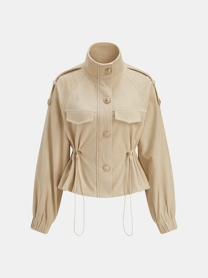 Corduroy utility jacket buttoned to the high stand collar, showing cinched peplum waist