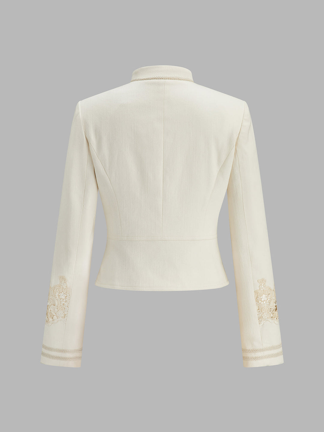 Back of the off-white cropped military jacket showing lace embroidery on both sleeves