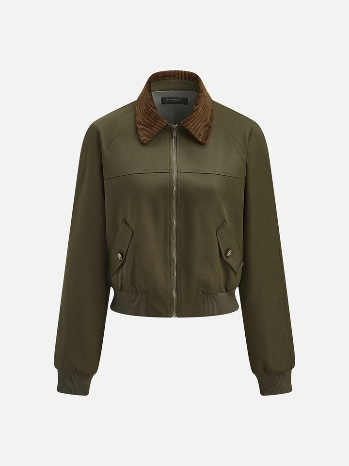 Three-quarter product view of the olive bomber showing flap pockets and zip closure