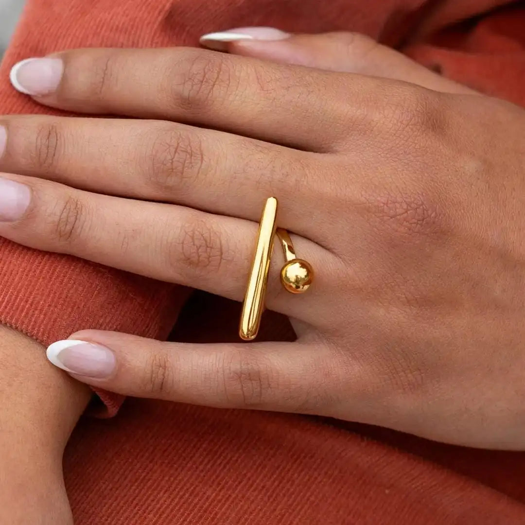 Main shot of the minimalist gold adjustable ring