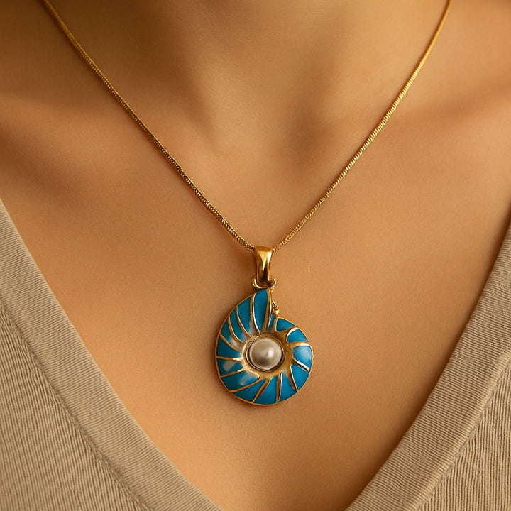 Seashell pearl necklace photographed beside a coastal styling backdrop