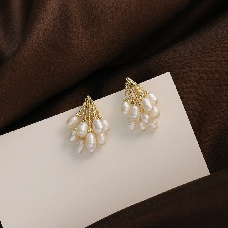 Close-up of the cascading pearl drops on the earrings