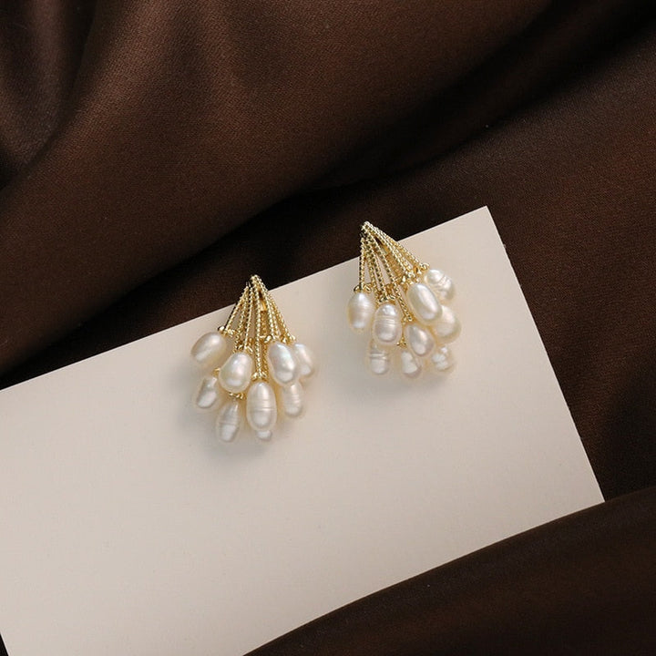 Close-up of the cascading pearl drops on the earrings