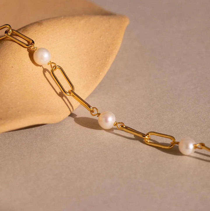 Side view showing the bracelet's clasp and chain detail