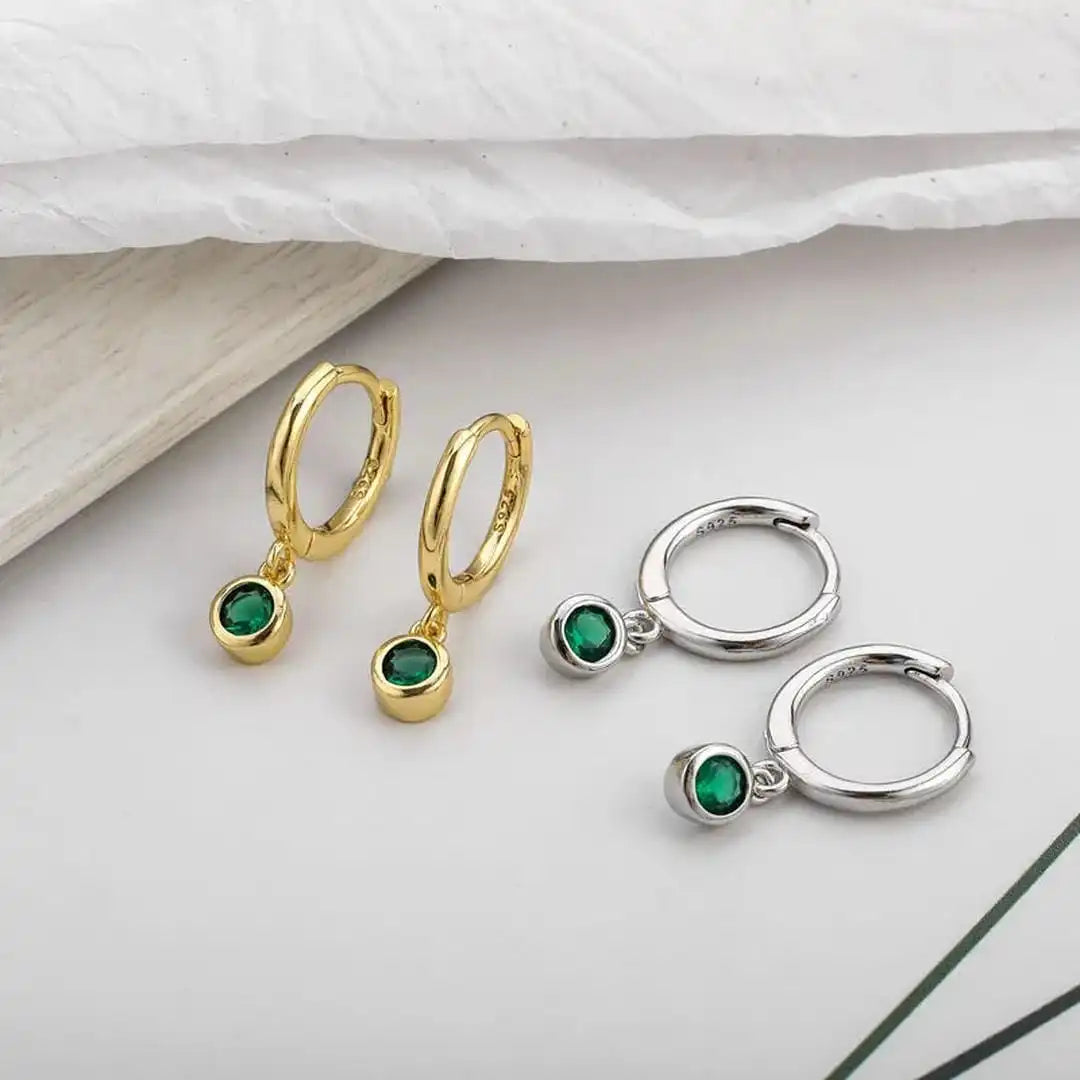 Main shot of the shimmering green zircon earrings