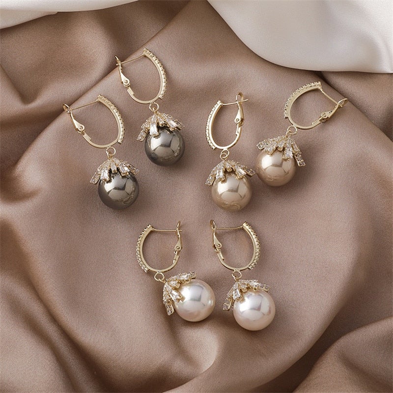 Model wearing the pearl baby stud earrings