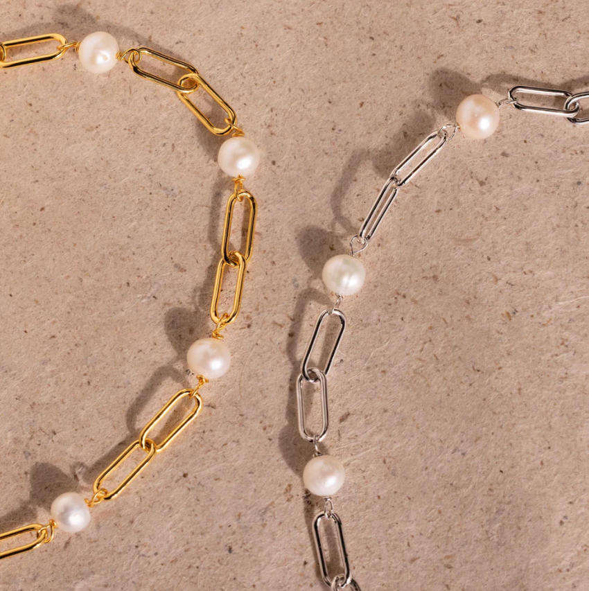 Close-up of a single pearl bead on the chain