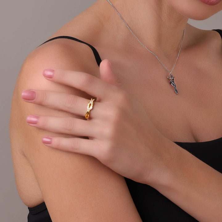 Twisted Knot Statement Ring worn on a woman's finger