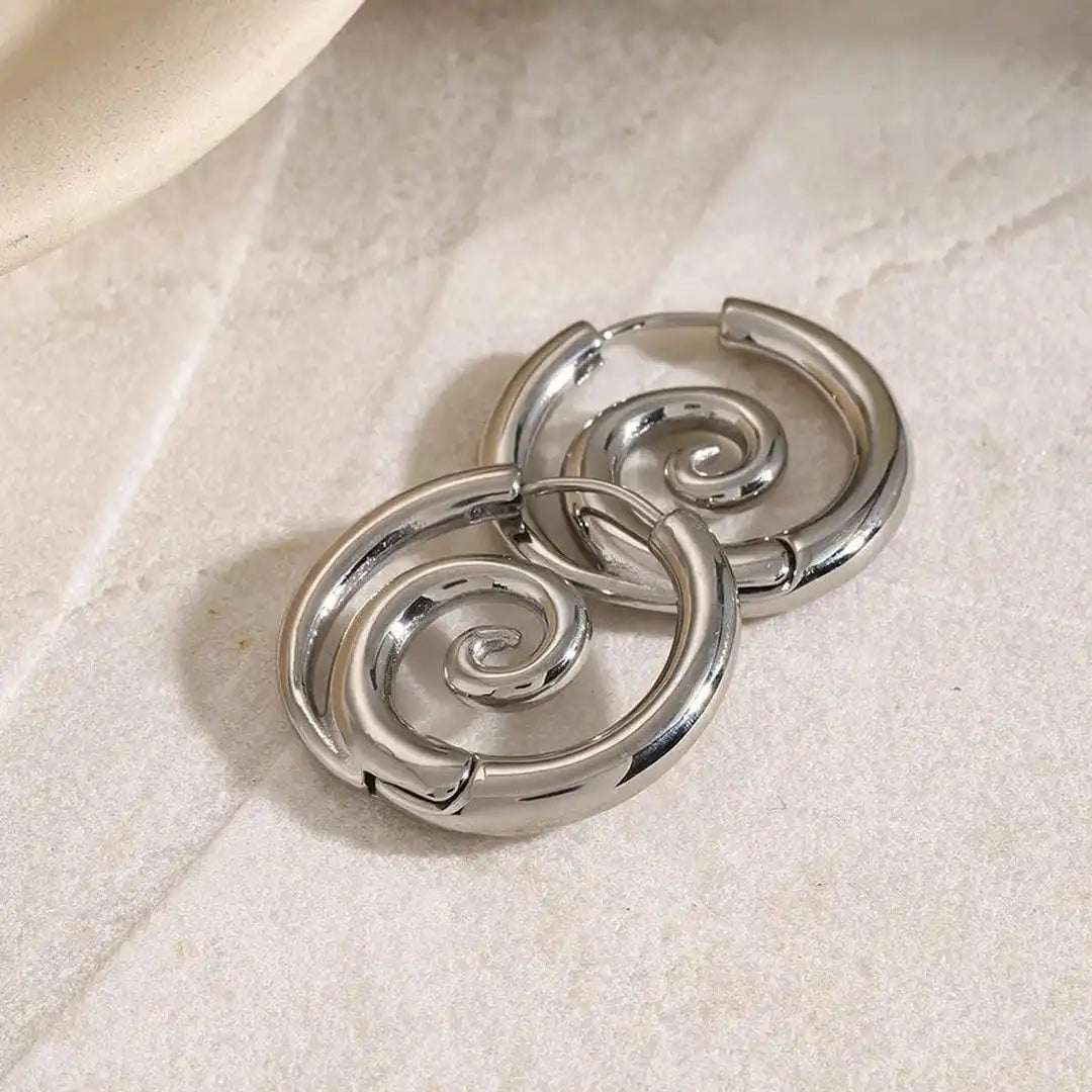 Both earrings displayed together on a jewellery tray