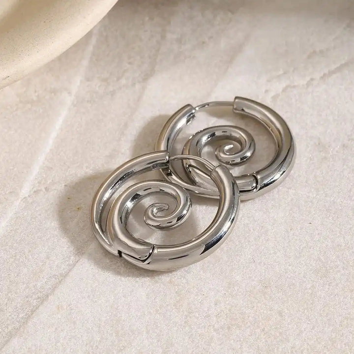 Both earrings displayed together on a jewellery tray