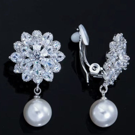 Earrings worn on a model showing the blossom detail